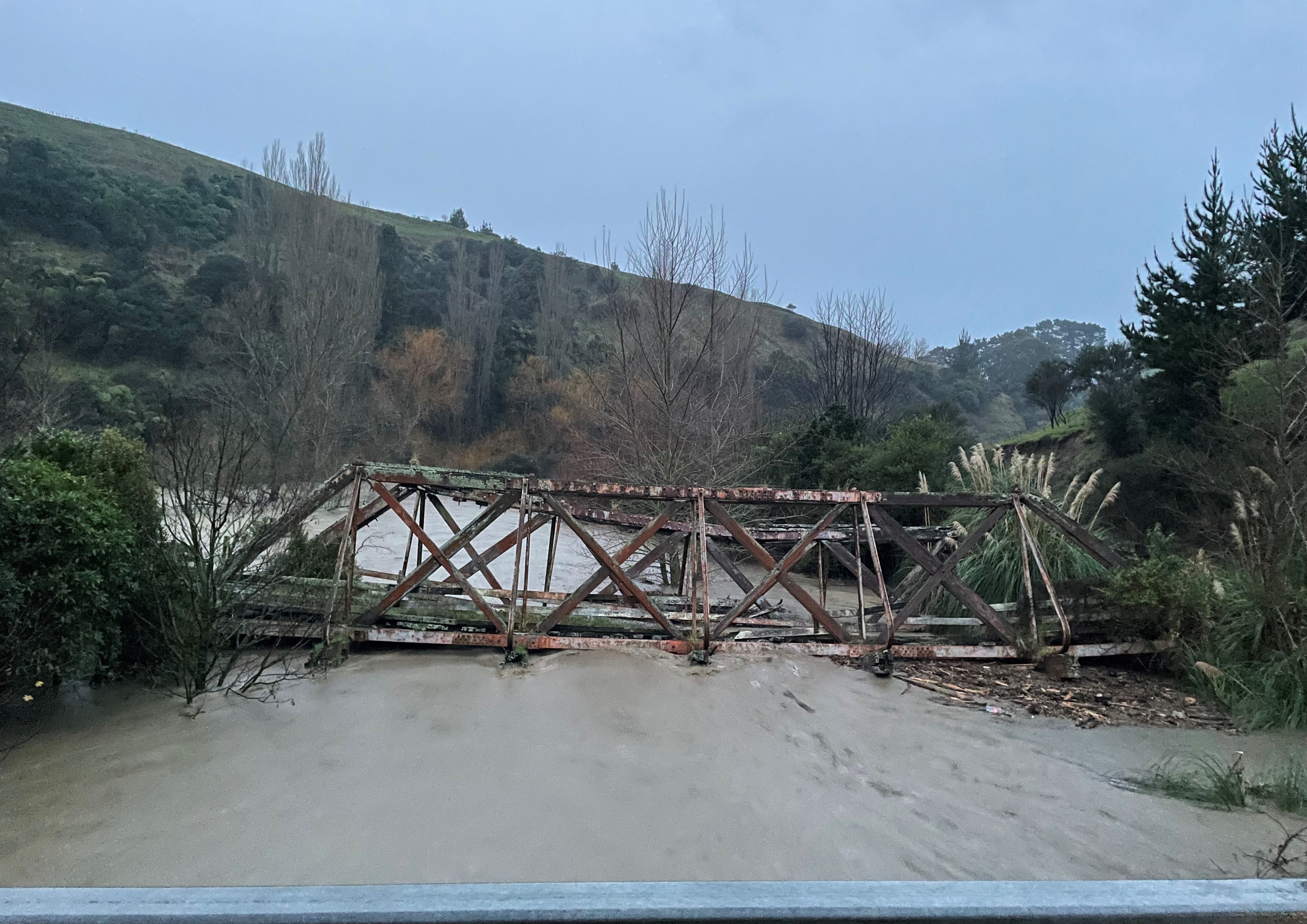 Mangemange Stream Bridge during flooding on 3 July 2025. Andrew Edgcombe. Heritage Sites and features image collection.