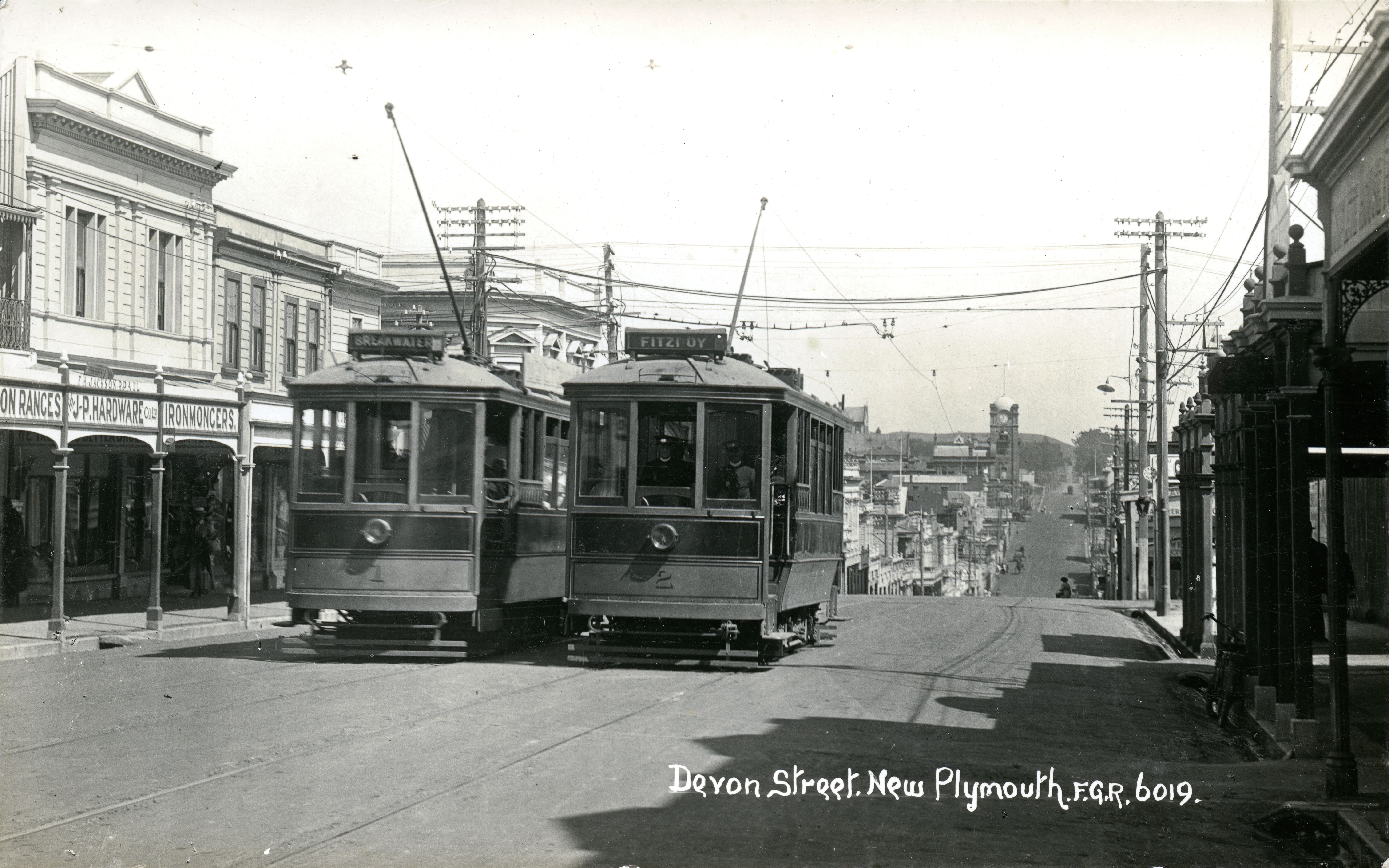 Devon Street, New Plymouth with the clock tower in the background (1916). FG Radcliffe. Collection of Puke Ariki, New Plymouth (PHO2006-012).