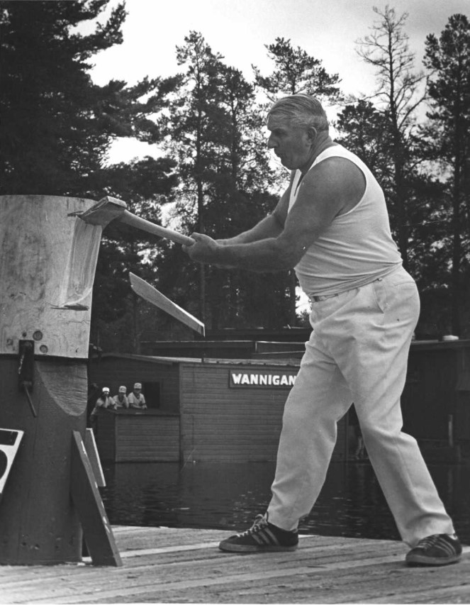 Mervyn Jensen competing at a wood chopping competition. Photo sourced from a family tree on Ancestry.com.